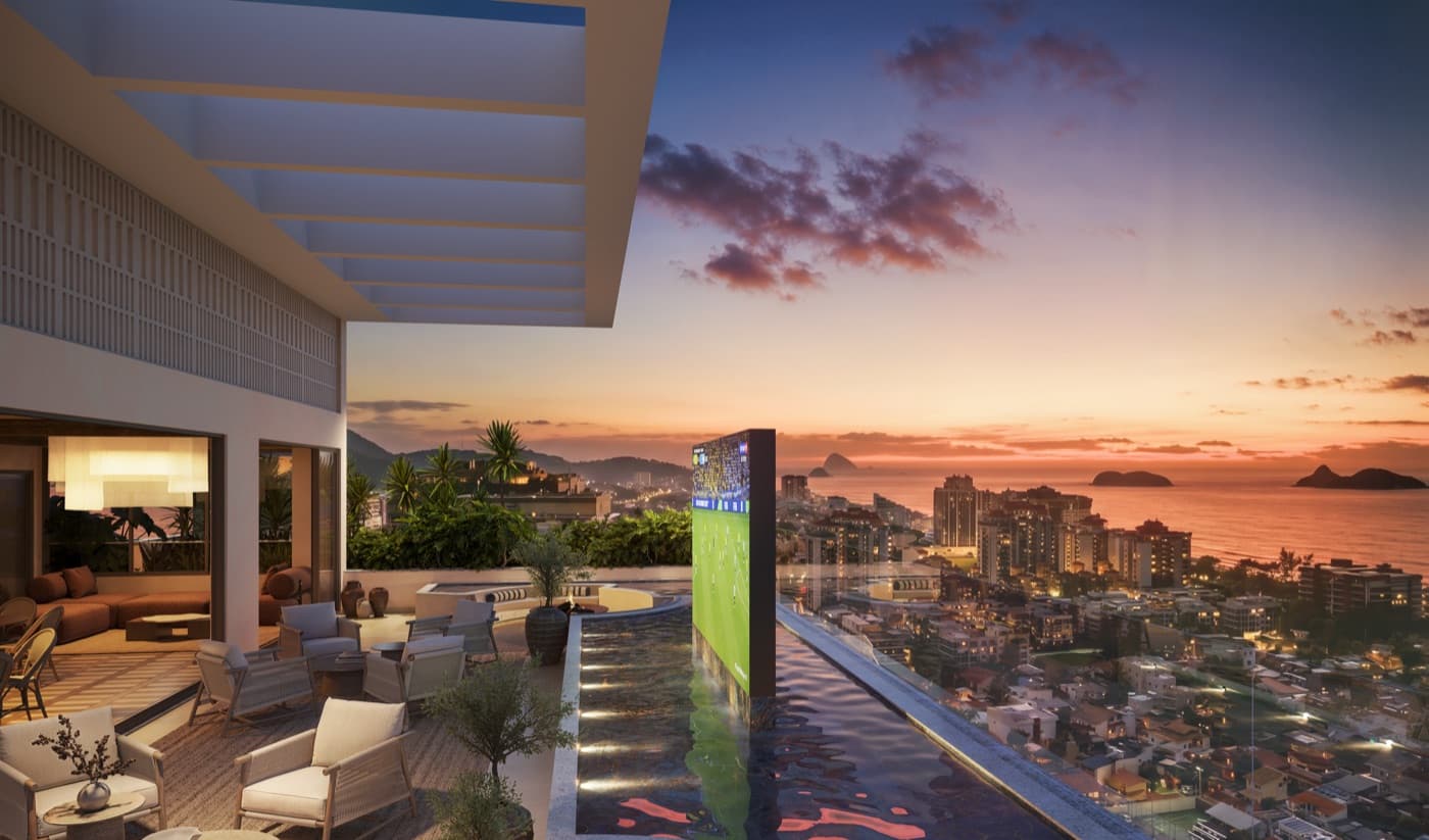 Rooftop com telão e piscina do KRONOS by Tegra ao entardecer